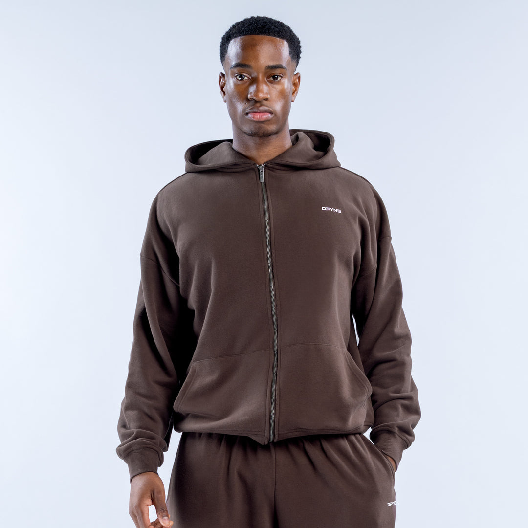 Brown heavyweight zip hoodie with a hood, front pockets, and small chest logo
