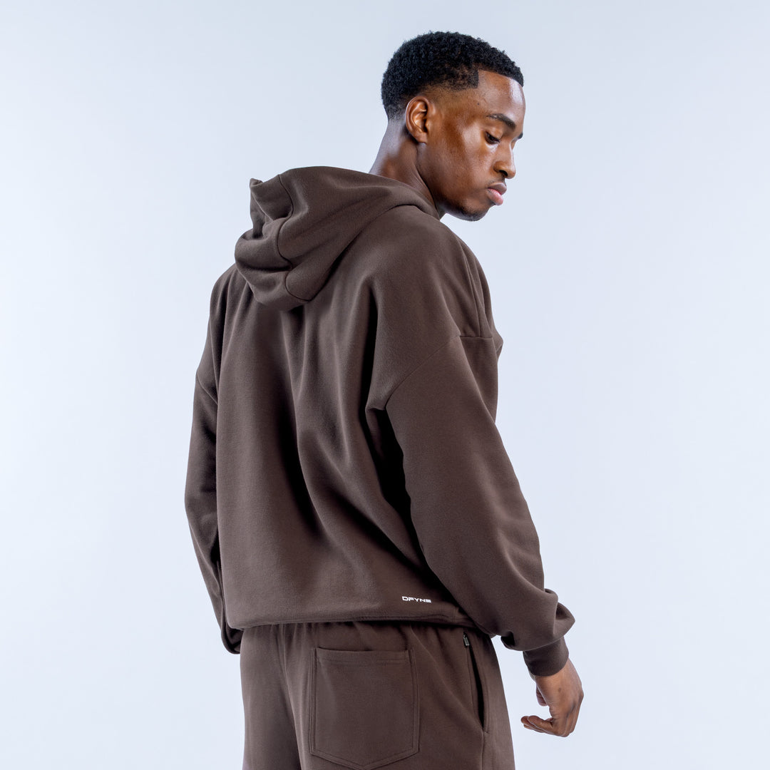Brown zip hoodie shown from the back, with a hood and small logo near the hem