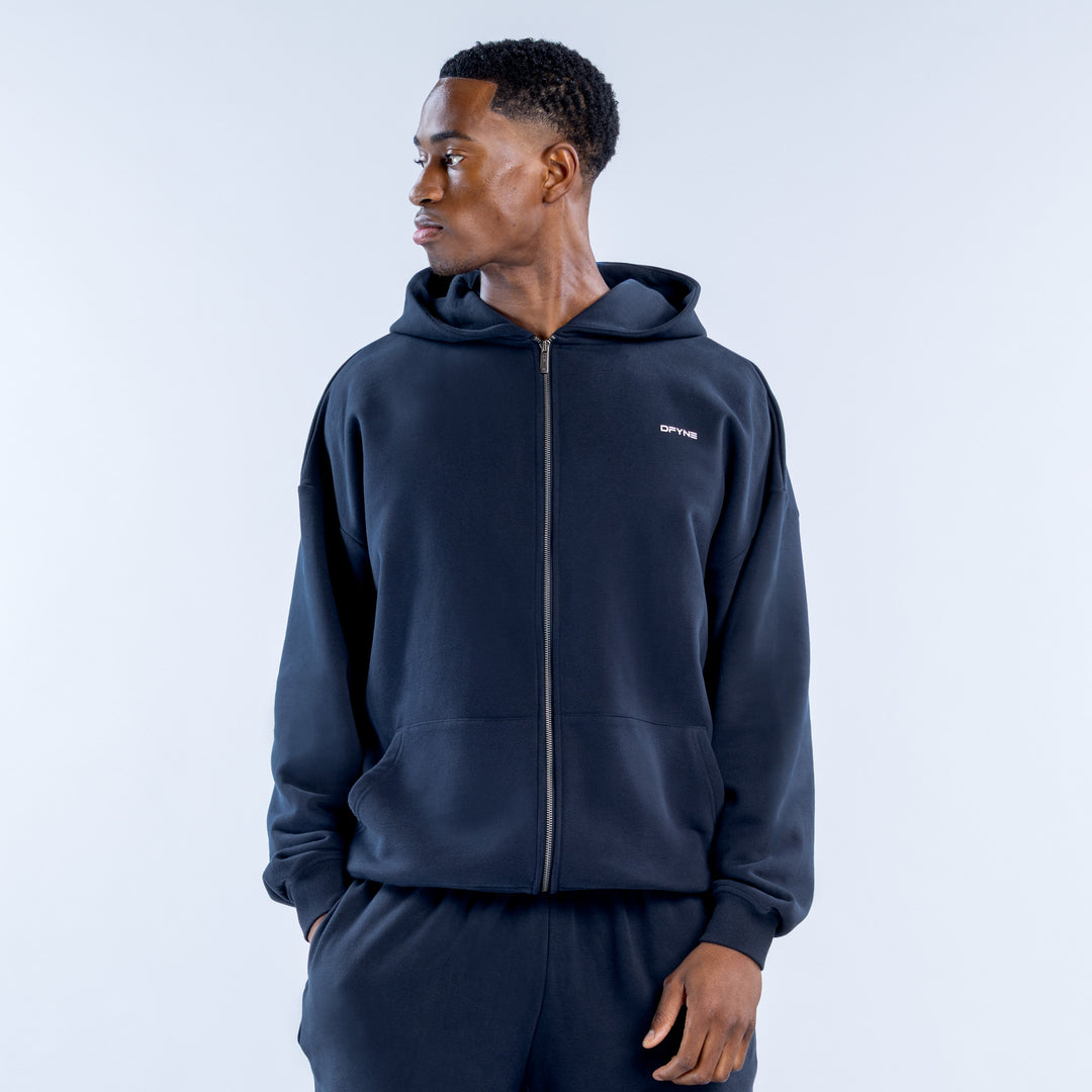 Navy heavyweight zip hoodie with hood, front pockets, and small chest logo