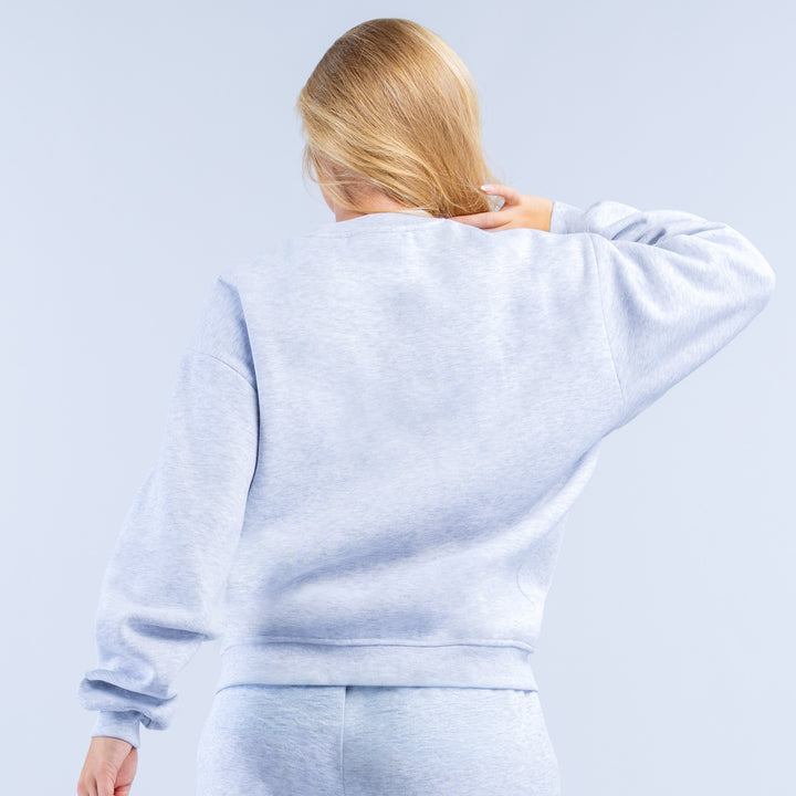 Light blue graphic sweatshirt, back view with crew neck and cuffs
