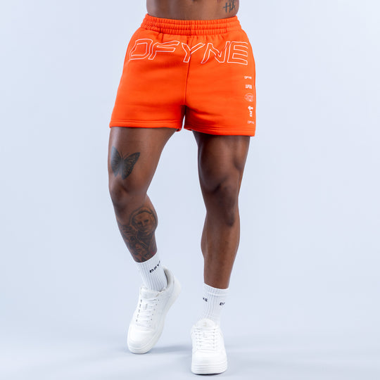 Orange jogger shorts with 'OFYNE' graphic on back, elastic waistband