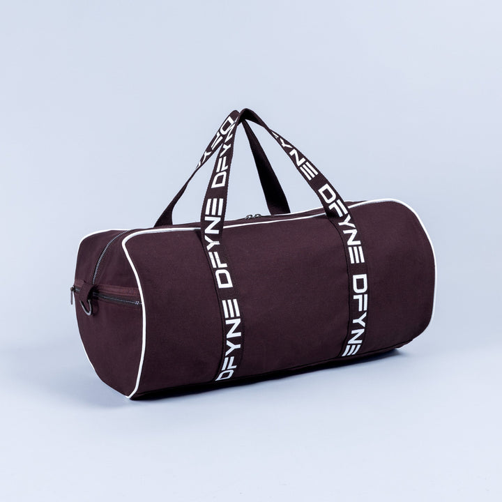 Burgundy duffle bag with white logo webbing straps and front zipper