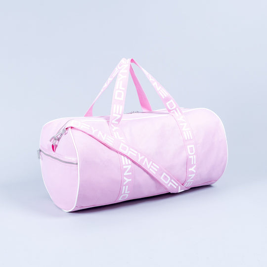 Light pink duffle bag with zip top, side zipper pocket, and logo strap handles.