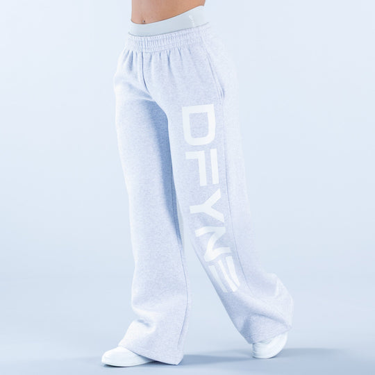 Light blue wide-leg jogger pants with elastic waistband and vertical graphic print